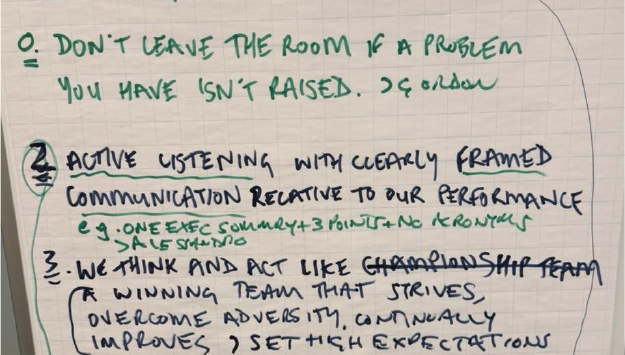Handwritten flip-chart rule created live in the room
